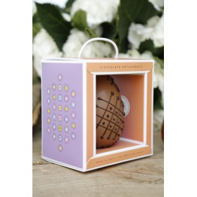 Milk chocolate egg decorated by hand